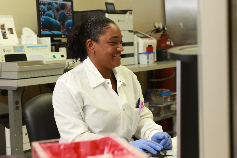 A Baptist Health employee team meeting in a hospital