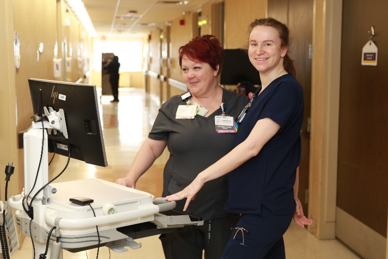 A group of male and female Baptist Health career professionals celebrating 1000 years.